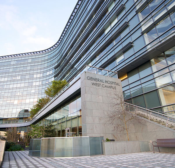 Hospital exterior with sign stating "General Hospital West Campus"