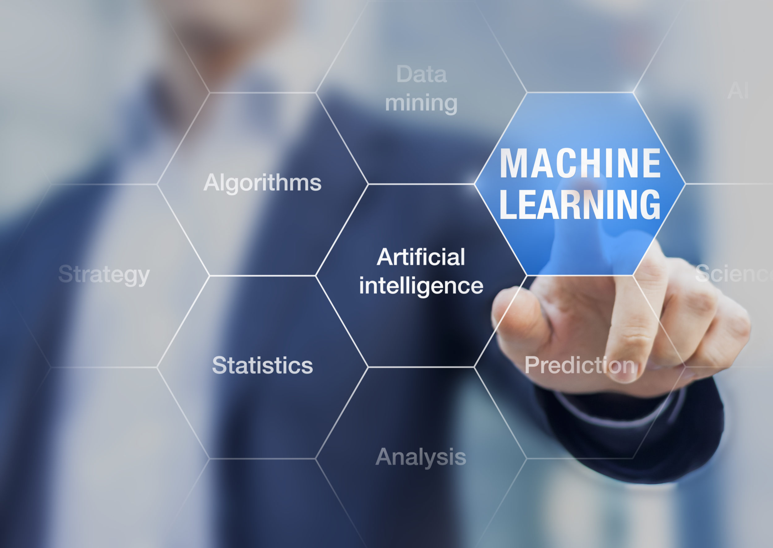 Business man touching a screen with the words "machine learning" displayed