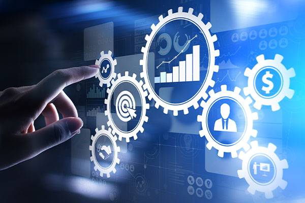 hand reaching to touch screen with gears and charts on it