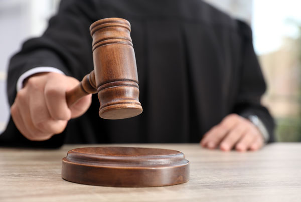 judge hammering a gavel on a table