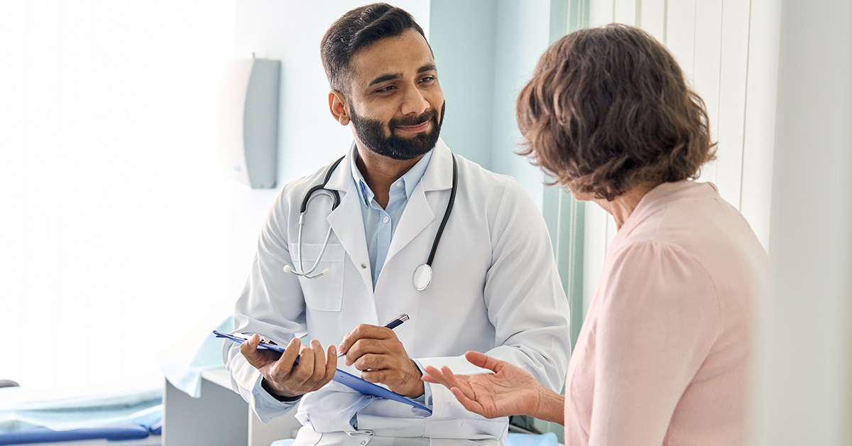 Doctor talking to woman